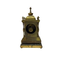 French - late 19th century 8-day mantle clock in a satin gilt brass case, with a rectangular porcelain panel to the front incorporating cartouche Roman numerals and a depiction of two lovers, cupid, and musical instruments,
Eight-day movement striking the hours on a bell, case standing on a gesso padded plinth.
