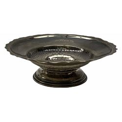 Early 20th century silver footed dish with frilled rim and plannished centre hallmarked Norton & White, Birmingham 1908, H4cm D12cm. 