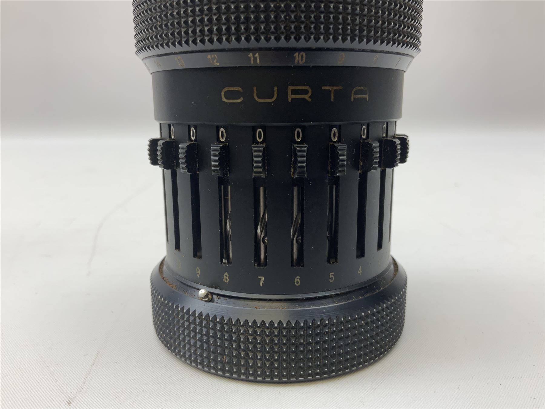 Curta Type II mechanical calculator by Contina Ltd Mauren, Liechtenstein, serial no. 500388 c1953 in original domed black metal case, H13cm 