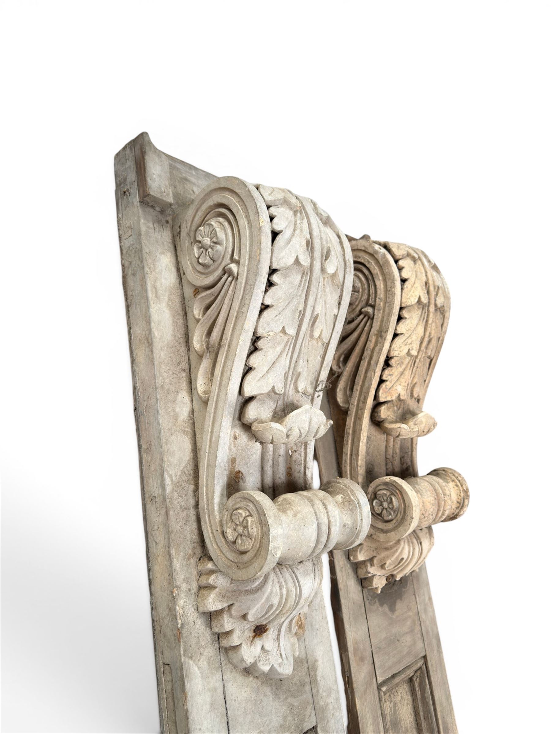 Pair of 19th century pine architectural pilasters, with painted terracotta capitols, with acanthus and scroll detail (18cm x 15cm x 57cm)