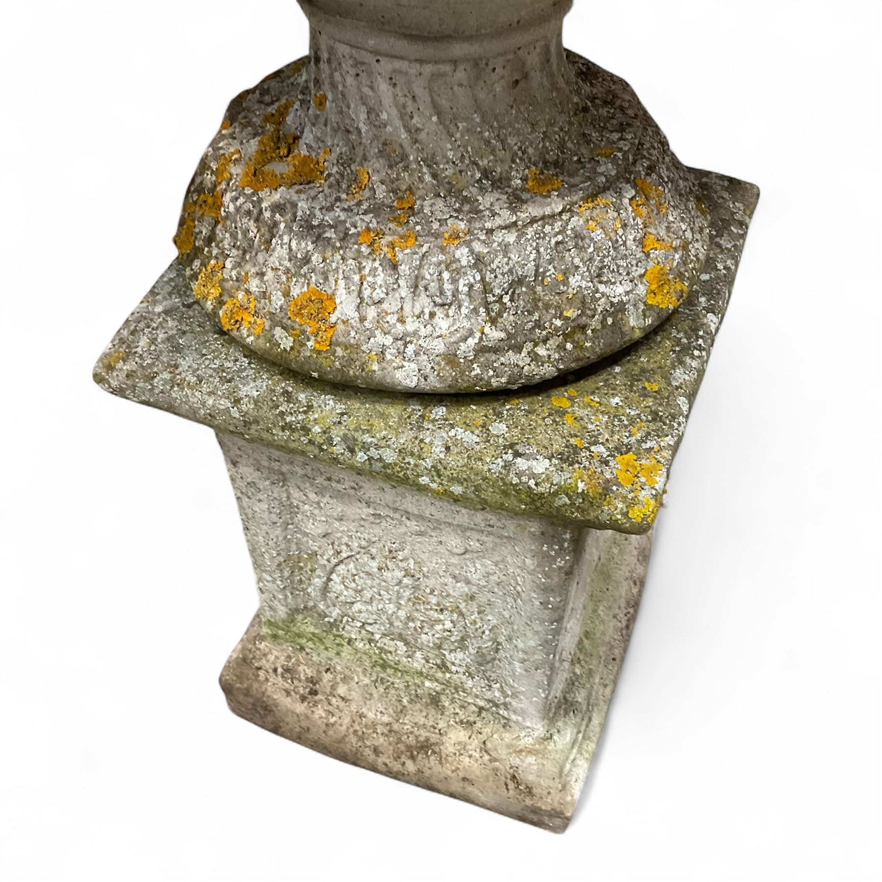 Pair of cast stone ornate garden urns, on plinth bases