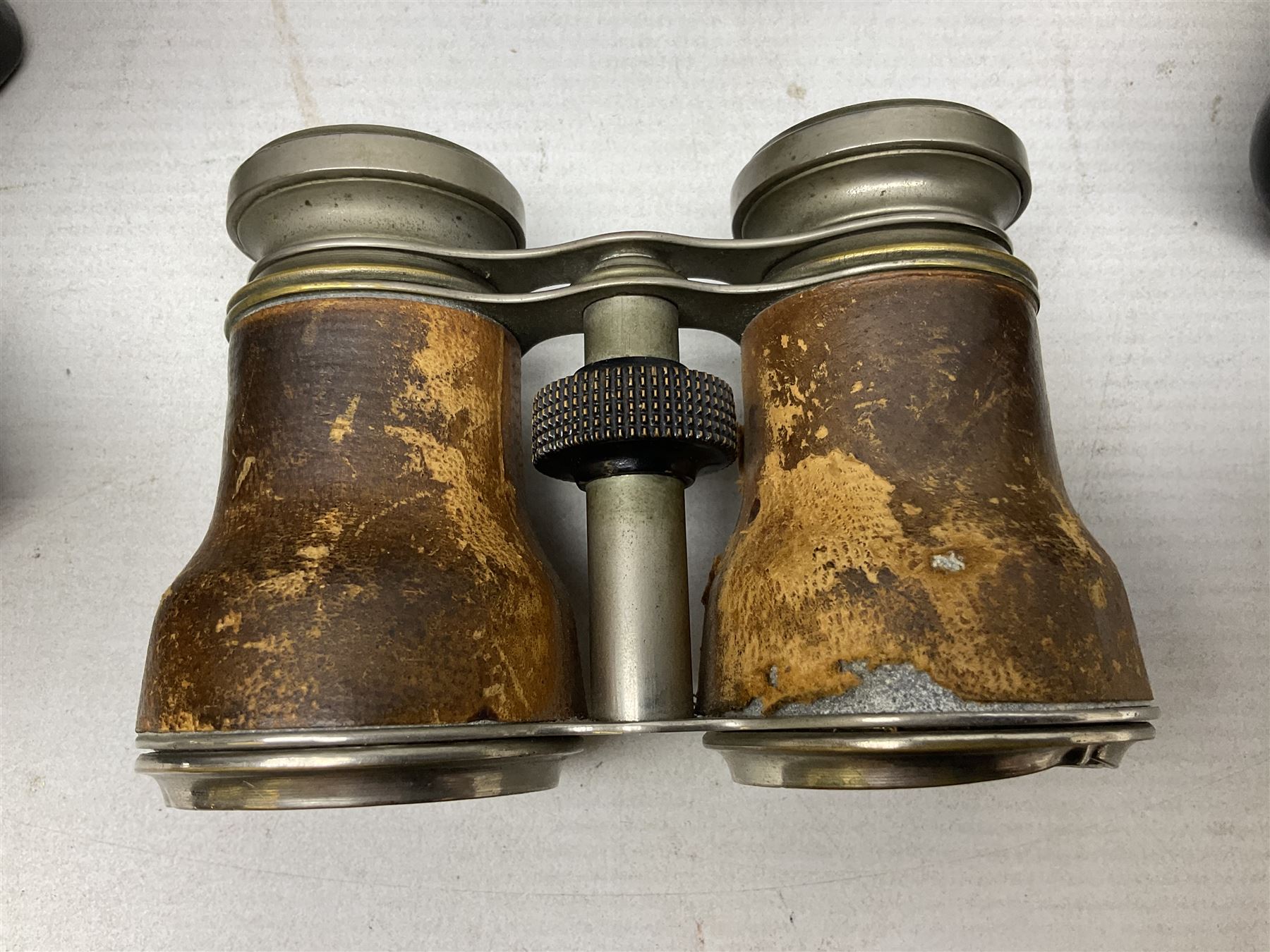 Olympus OM10 35mm camera, cased; pair of USSR 7 x 50 binoculars; cased; and pair of Le Jockey Club Paris binoculars