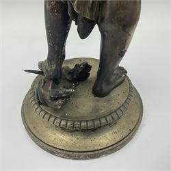 20th century silver plated figure, modelled as a classical male figure, possibly Prometheus, holding flames, one foot resting atop a small dragon, upon a circular spreading base, overall H37.5cm