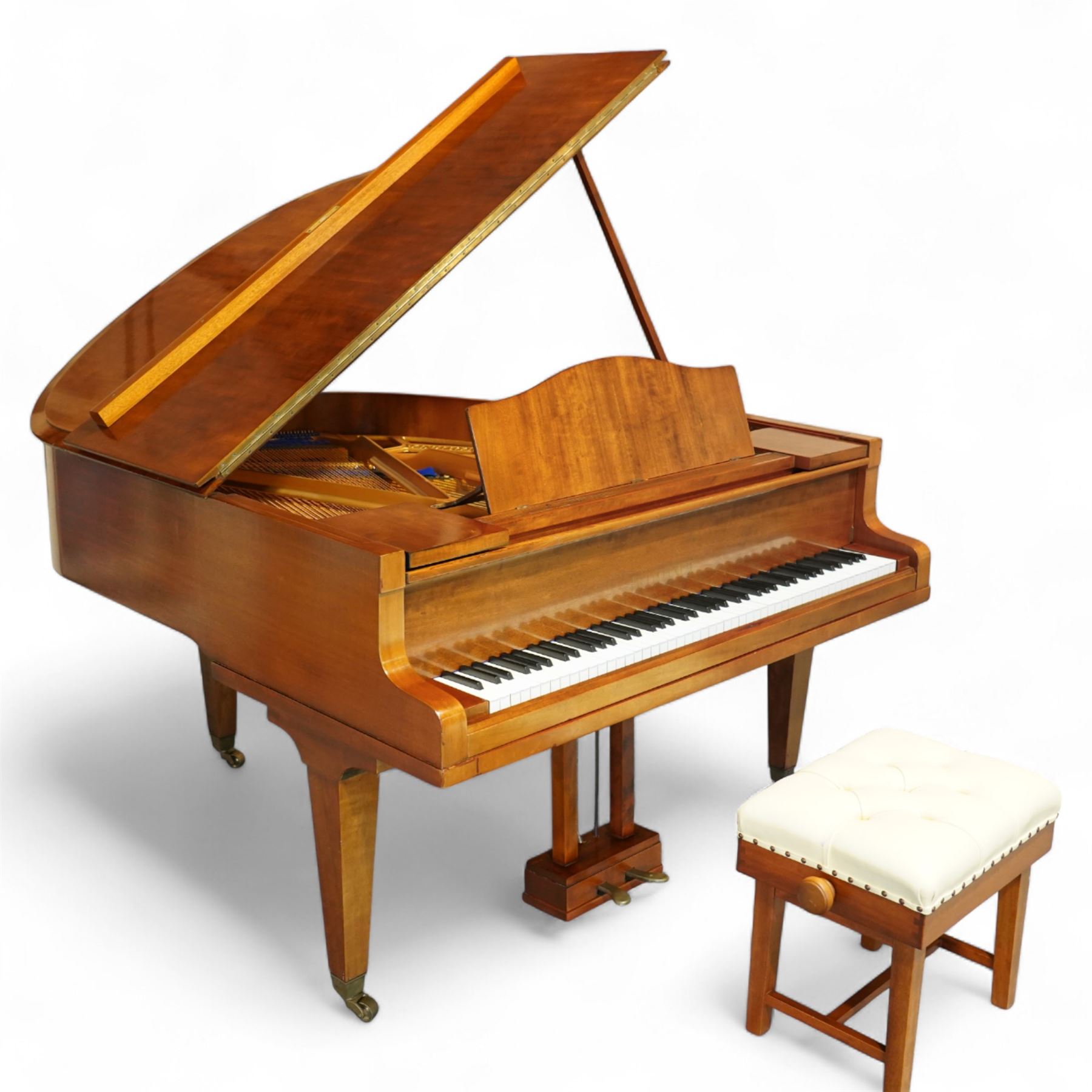 Julius Bluthner-light mahogany overstrung Baby Grand Piano serial No 118183 (1934), with a grand roller action, 88 ivory and ebony keys AO-C7, raised on three square tapered legs with brass castors, adjustable music desk and Lyre with sustain and una-corda pedals, recently (2007) thoroughly restored, case re-finished and polished, action completely overhauled and adjusted with good repetition, frame totally re-strung including copper wound bass strings, new tuning pins, hammer heads, dampers and traditional blue Bluthner string felt, in very good playing condition. With a matching adjustable piano stool fitted with a leather cover. Tuned to concert pitch, A=440.  Complete with key fall lock and key and three castor cups.
This item has been registered for sale under section 10 of the APHA Ivory Act, Reference X76CPCS8