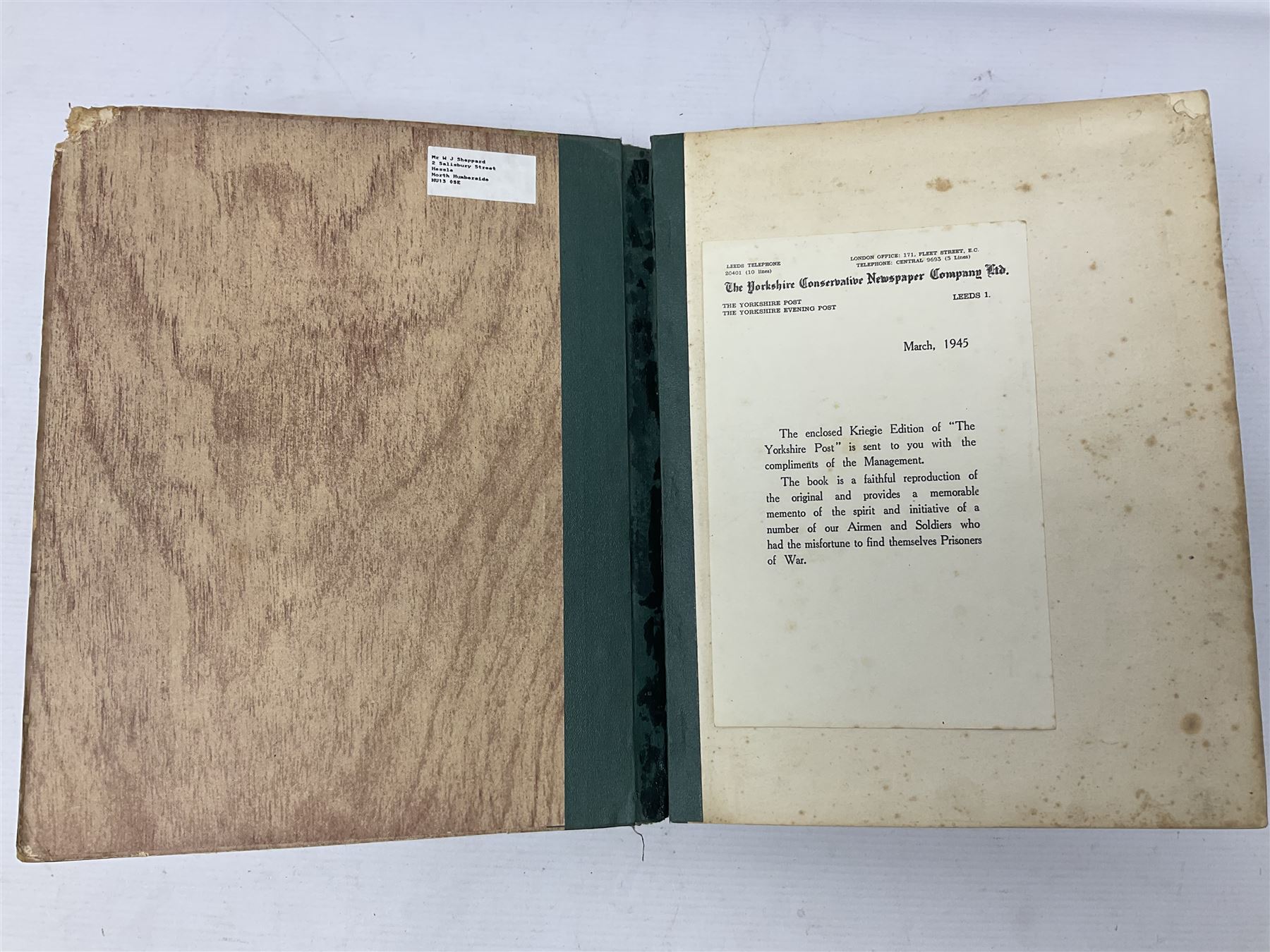 The Yorkshire Post Kriegie Edition. A 1945 book reproducing the exploits of Prisoners of War in Stalag Luft VI, with compliments letter from the publishers. Simulated wood paper covered card boards.