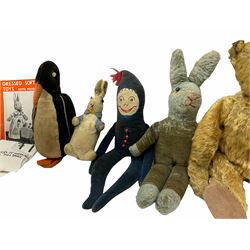 1950's teddy bear with jointed limbs, revolving head, wood filled body, stitched nose and mouth, applied glass eyes and foot pads, together with a quantity of handmade soft toy rabbits and penguins. 