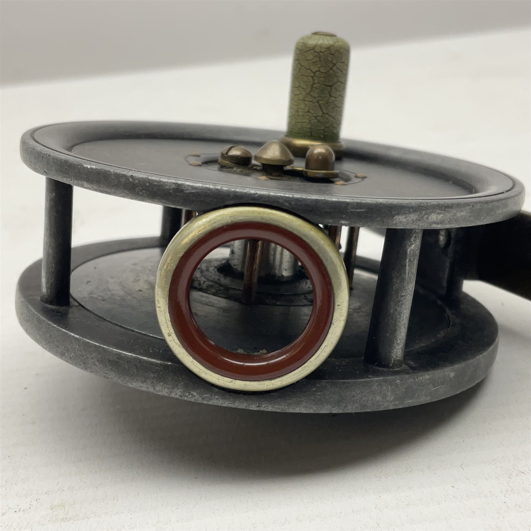 3 inch trout fly reel, with brass foot, original handle and telephone centre latch, unmarked but in the style of Hardy Uniqua 