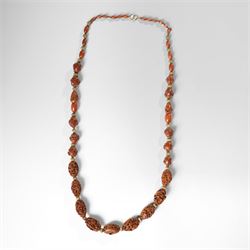 Chinese Hediao necklace, comprising twenty-one pierced and carved seeds strung with smalle...