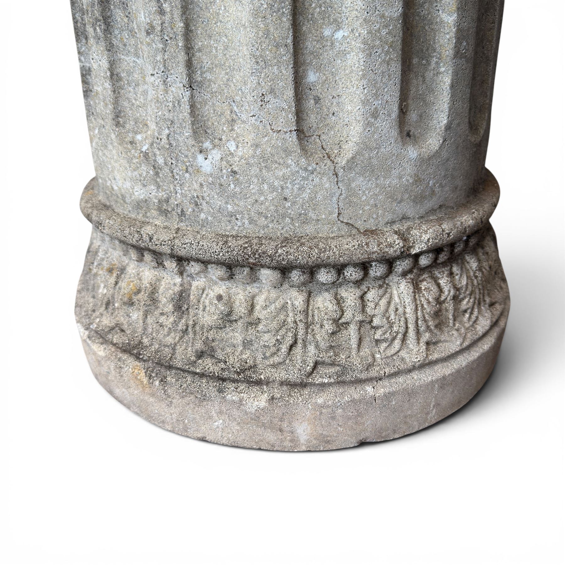20th century good quality weathered cast stone pedestal urn of ecclesiastical design, circular lobed bowl with rope twist and lattice border, raised on squat base with fluted column  and acanthus decorated base