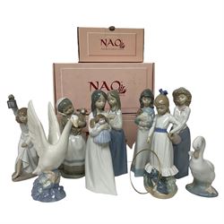 Collection of nine Nao figures, to include Who's There? no 111,  Girl with Hoop, Girl With Lamb  no 120 etc, three with boxes