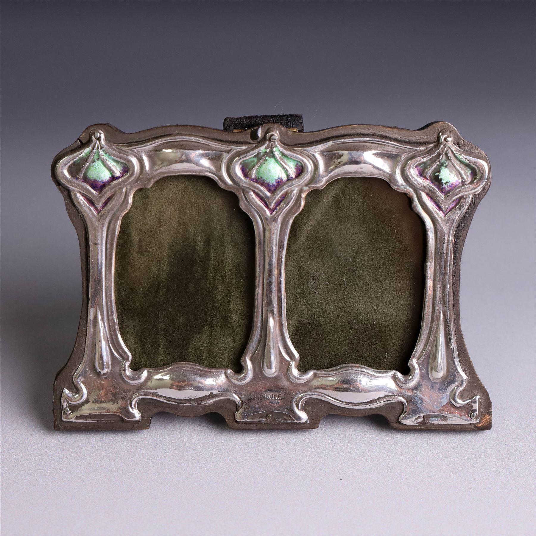 Silver mounted Art Nouveau style double photograph frame, with enamel decoration and wooden easel stand verso, stamped Sterling H8cm, W11cm,