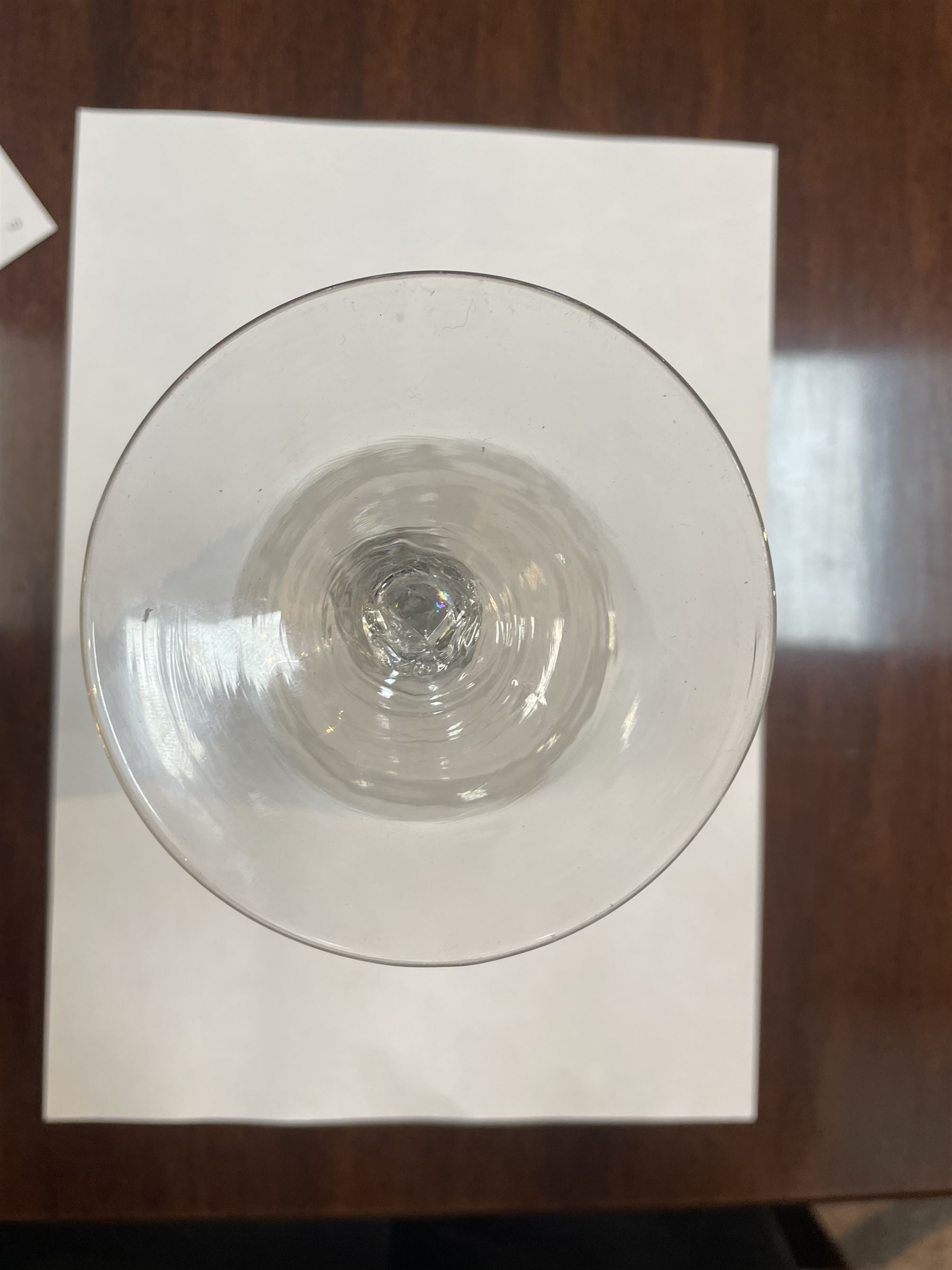 Dutch engraved Newcastle light baluster glass, circa 1760, the funnel bowl engraved with a two storey country house and church flanked by trees, beneath the inscription ‘T WELVAREN VAN LANDT ENKERK’ (The prosperity of the Country and Church), upon a multi knopped stem with beaded knop and basal knop, over conical foot, H18cm



