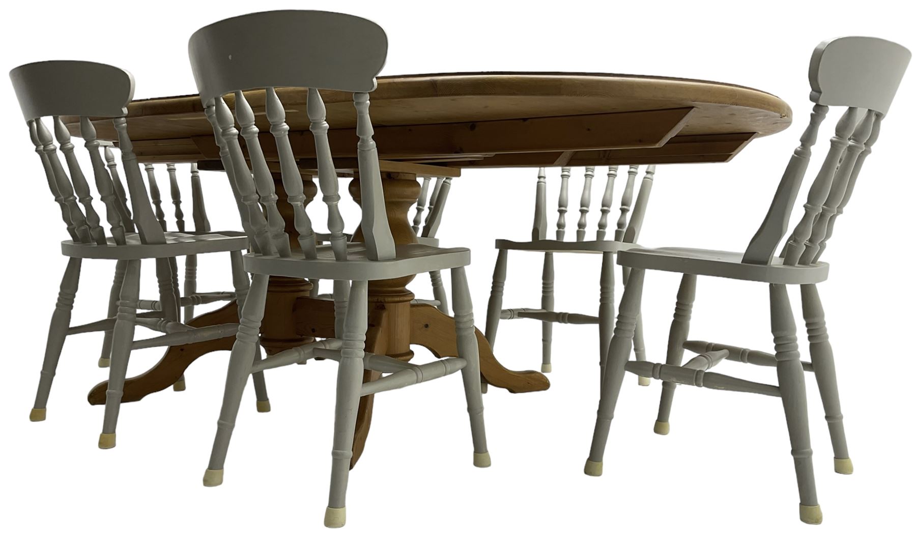 20th century pine extending dining table, oval top over twin bulbous turned pedestal base united by stretcher, with additional leaf (W160cm D120cm H79cm); and set of seven ash painted dining chairs, spindle back, raised on ring turned supports joined by H-stretcher