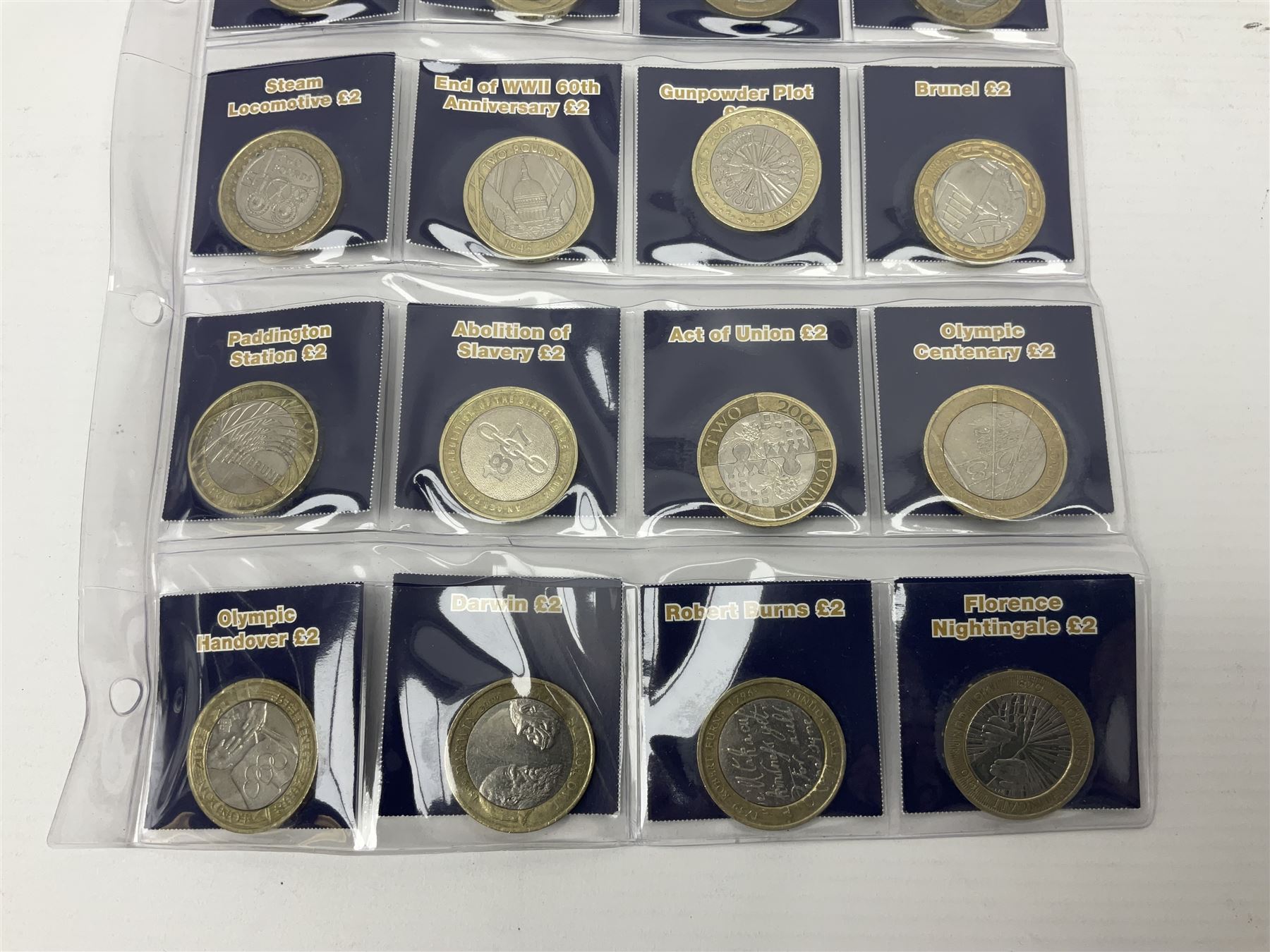 Mostly United Kingdom Queen Elizabeth II commemorative two pound  coins, including 2017 'Jane Austen', 2018 'Sea King', 2018 'Vulcan' etc face value of UK coins approximately 98 GBP