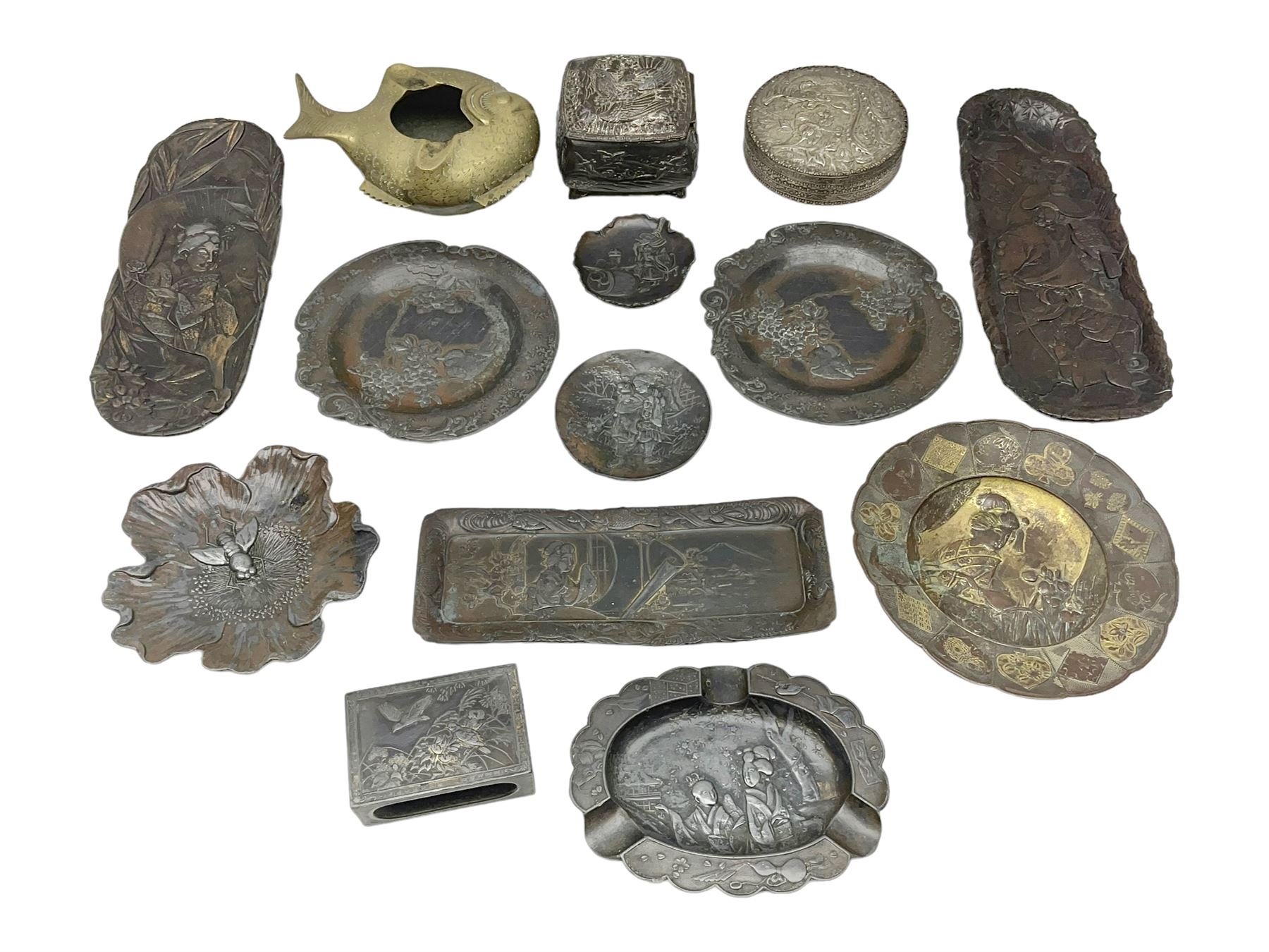 Brass sunfish ashtray, Chinese silver plated trinket box with mirror, bronzed matchbox cover and a collection of other Oriental bronzed embossed metal trays