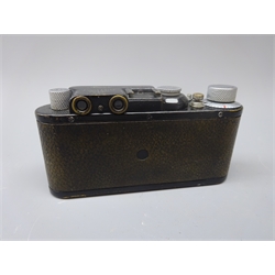  Leica 35mm film camera, Ernst Leitz Wetzlar D.R.P. No.91677, black with a Canon f1:1.8 50mm lens and cover  