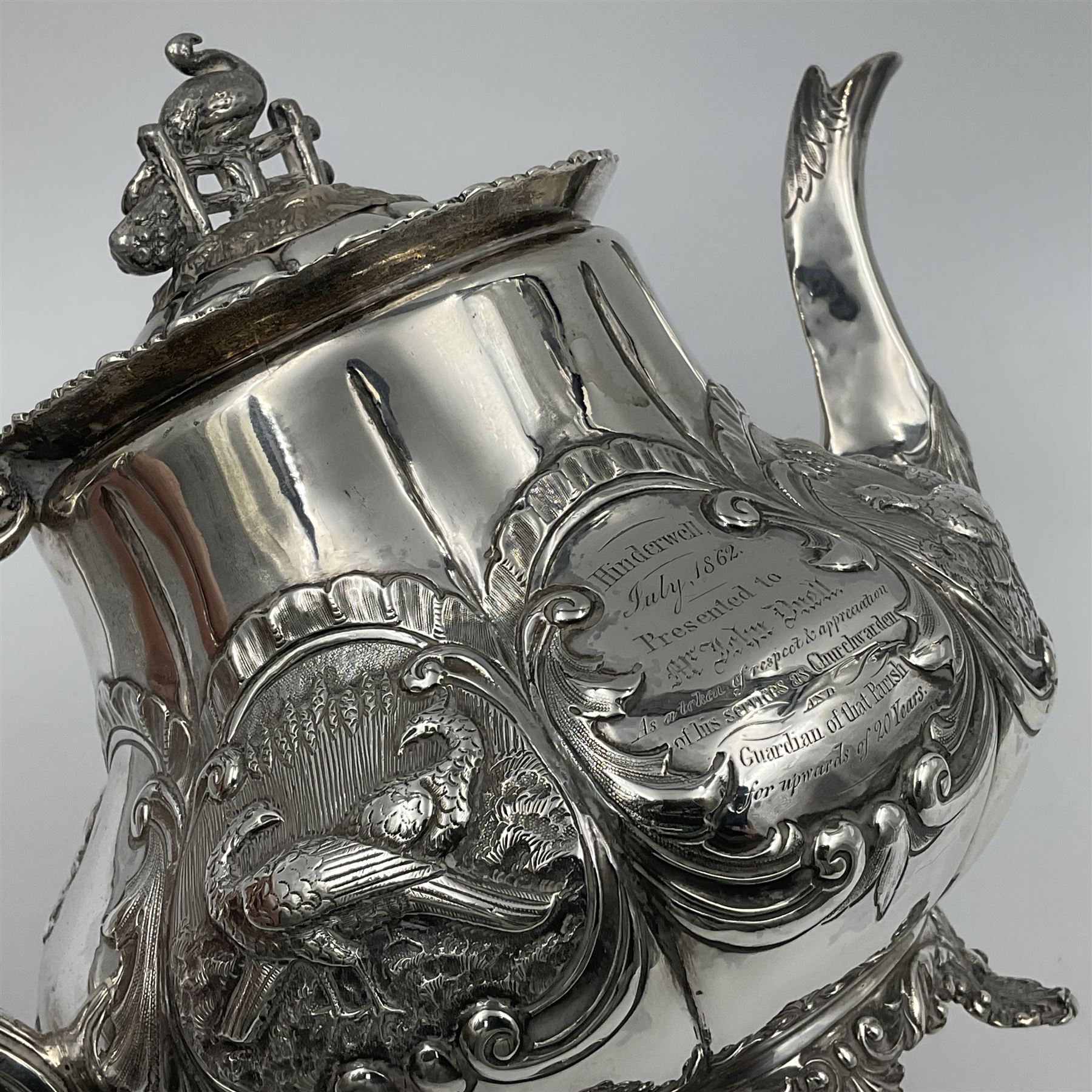 Victorian silver three piece tea service, comprising teapot, twin handled open sucrier, and milk jug, each of bellied form with acanthus capped scroll handles, the sides embossed with alternating scroll edged vacant panels and panels containing a pair of birds, upon four palmette feet, the teapot with ivory insulators to handle, and bird finial to the hinged domed cover, hallmarked William Hunter & Son, London 1861, teapot H19cm, including handles sucrier H13.5cm, including handle milk jug H12cm

This item has been registered for sale under Section 10 of the APHA Ivory Act