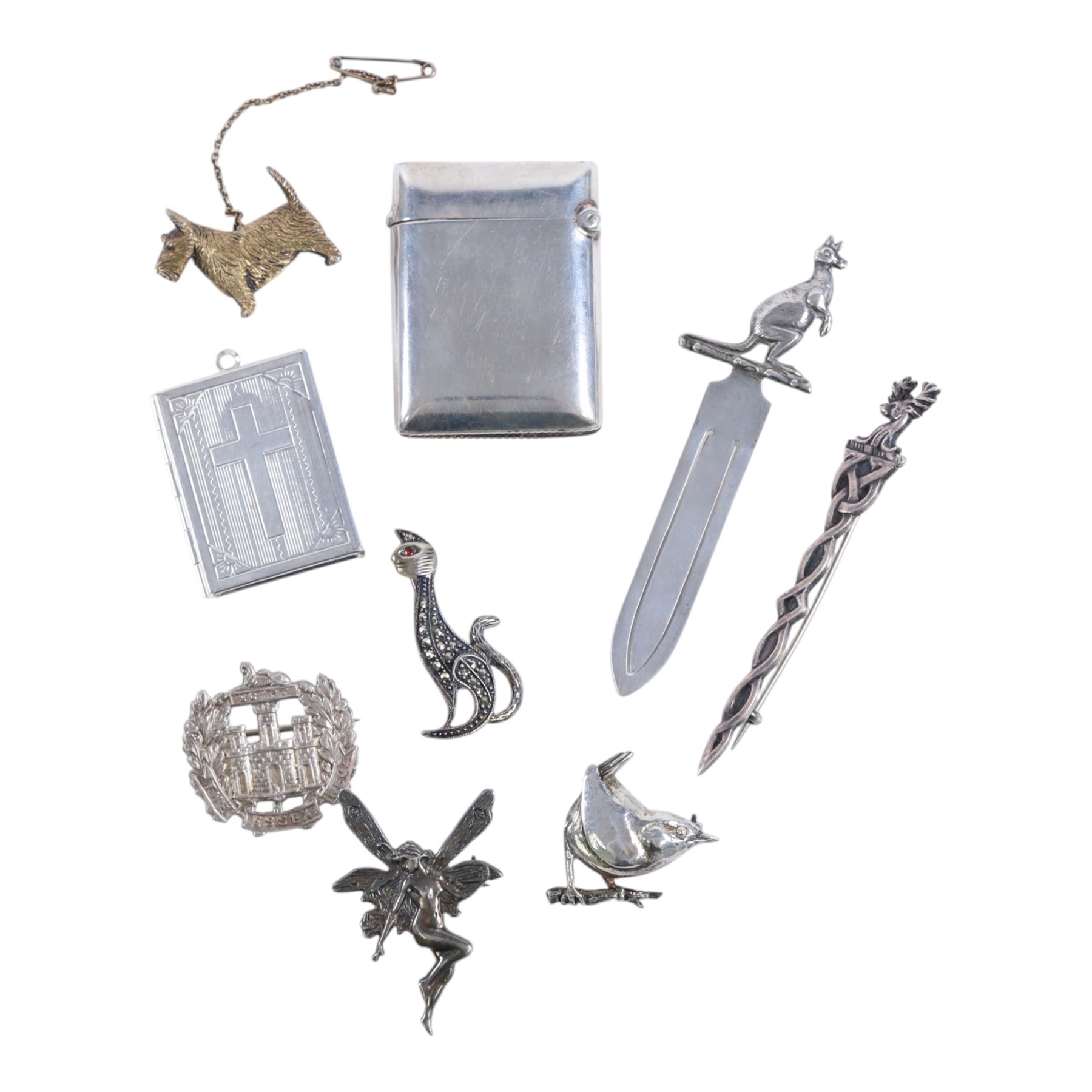 Collection of silver, including Kangaroo book mark, six silver brooches, comprising silver-gilt scottie dog, fairy, marcasite cat, Celtic stag, Essex regiment and wren, vesta case and bible locket