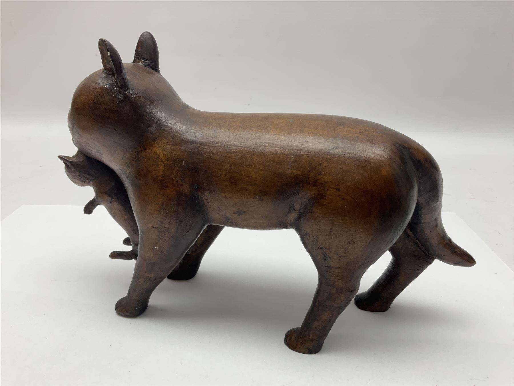 Folk Art wooden carving depicting a cat carrying a kitten, H16cm
