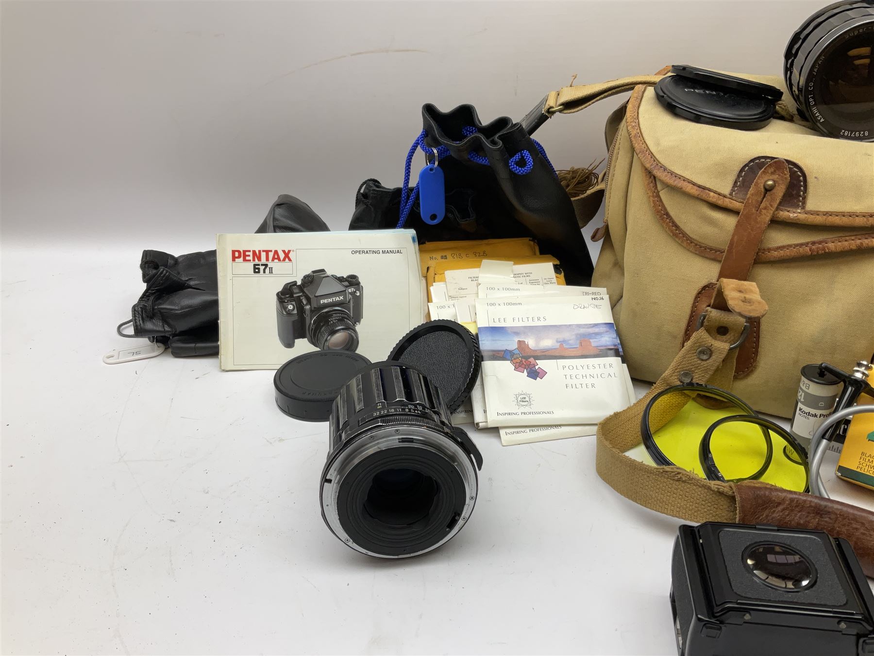 Pentax 67II camera with Asahi SMC Pentax - 6x7 ‘1:4 45mm’ lens, Asahi Takumar / 6x7 ‘1:4.5/75’ lens, Asahi Macro-Takumar / 6x7 ‘1:4/135’ lens, Asahi SMC Pentax - 6x7 ‘1:2.8 165mm’ lens, Asahi Pentax 6x7 rear converter ‘T6-2X’, lens filters and various other accessories, housed in a Billingham carry bag