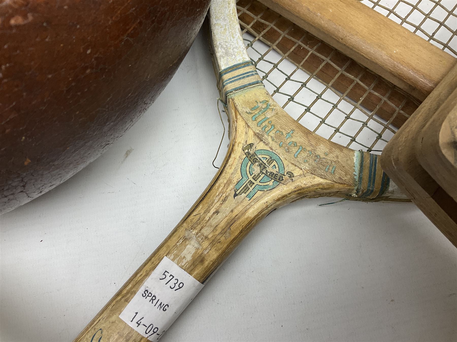 Quantity of early 20th century and later tennis rackets, to include Artus Majesty, Dunlop Alpha, Atlas Silver Shield and Raleigh Konni, together with a stitched rugby ball