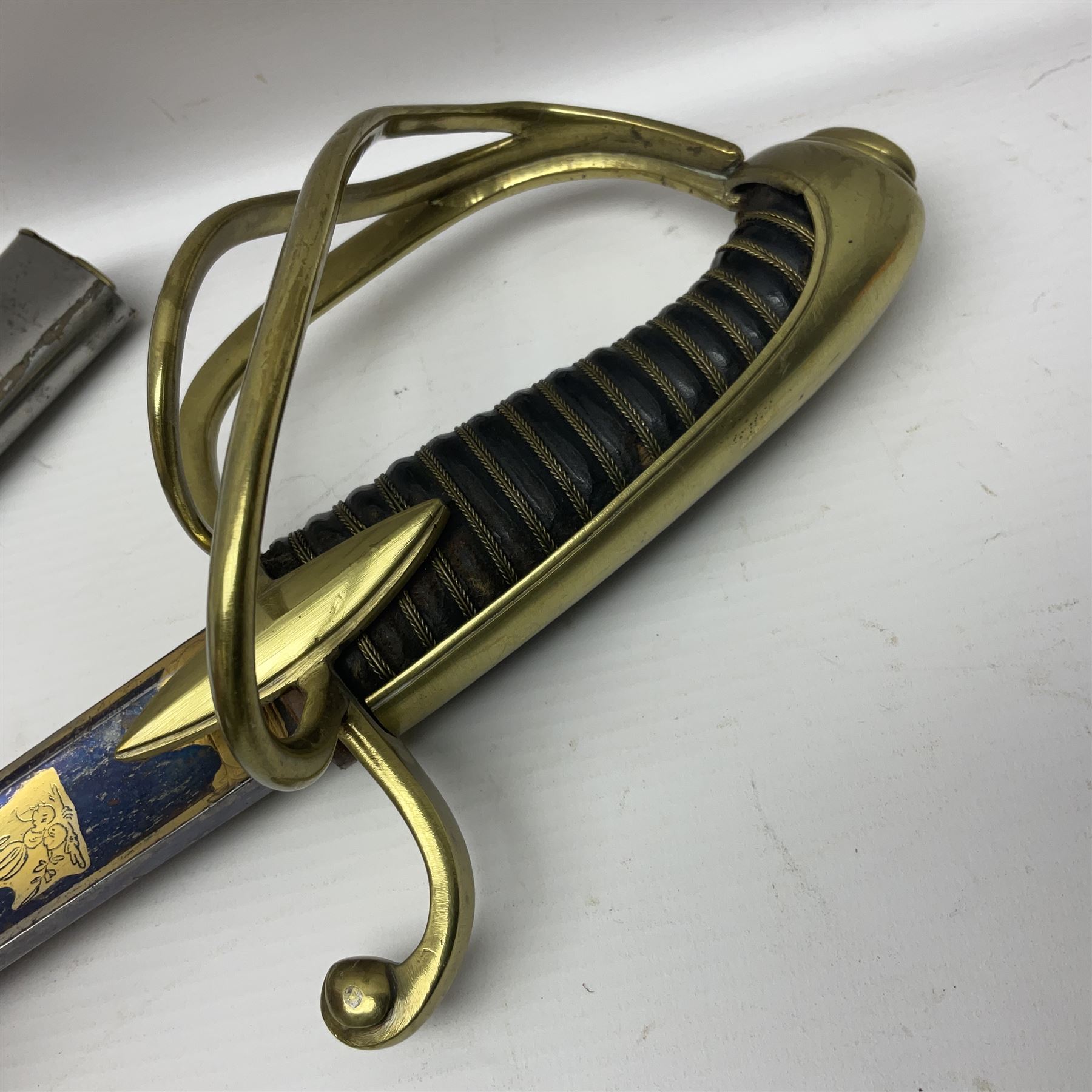 Early 19th century French Lancers officer's sword c1810, the 84cm curving fullered blade retaining most of its bluing, gilding and engraved decoration, inscribed I.S.& C. to ricasso (for Schimelbusch), brass three-bar hilt with elongated elliptical langets and wire-bound leather grip; in polished steel scabbard with two brass suspension rings L100cm overall