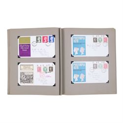 Collection of postcards in a album, together with an album of first day covers 
