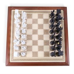 Franklin Mint - The Chess set of the Gods by Stuart Feldman, porcelain pieces, housed in fitted case with certificates 