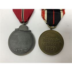 German War Merit Cross 1st Class, the pin-back stamped '50'; War Merit Medal; and Ostfront Medal for the Winter Campaign in Russia of 1941-1942 'Die Medaille Winterschlacht Im Osten'; all with ribbons (3)