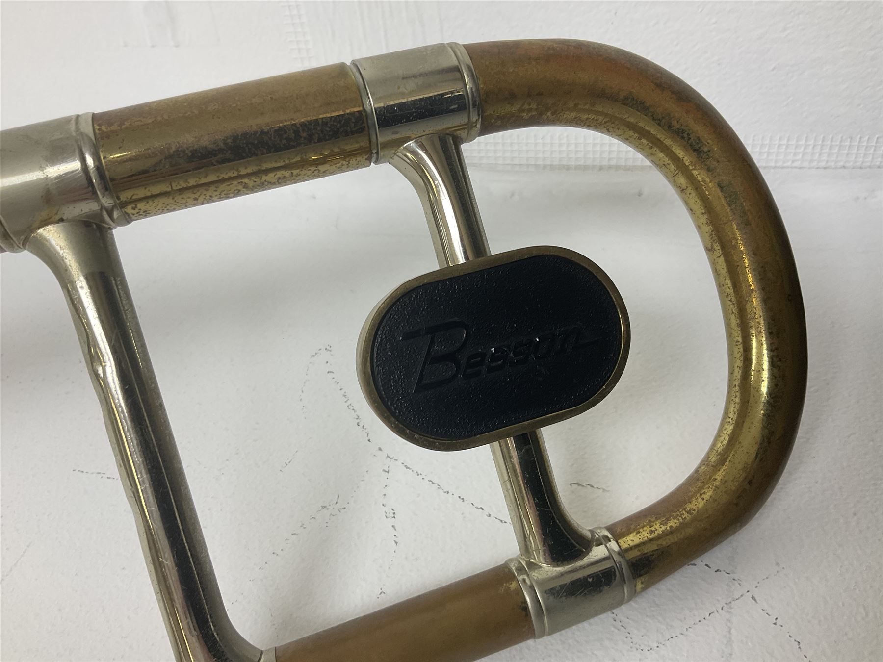 Three brass trombones comprising Elkhart Ind. USA 'CONN' model no.72H; Besson 'Concord'; and Selmer Distributed 'Lincoln'; two in carrying cases; and German B & M 'Champion' brass trumpet (4)