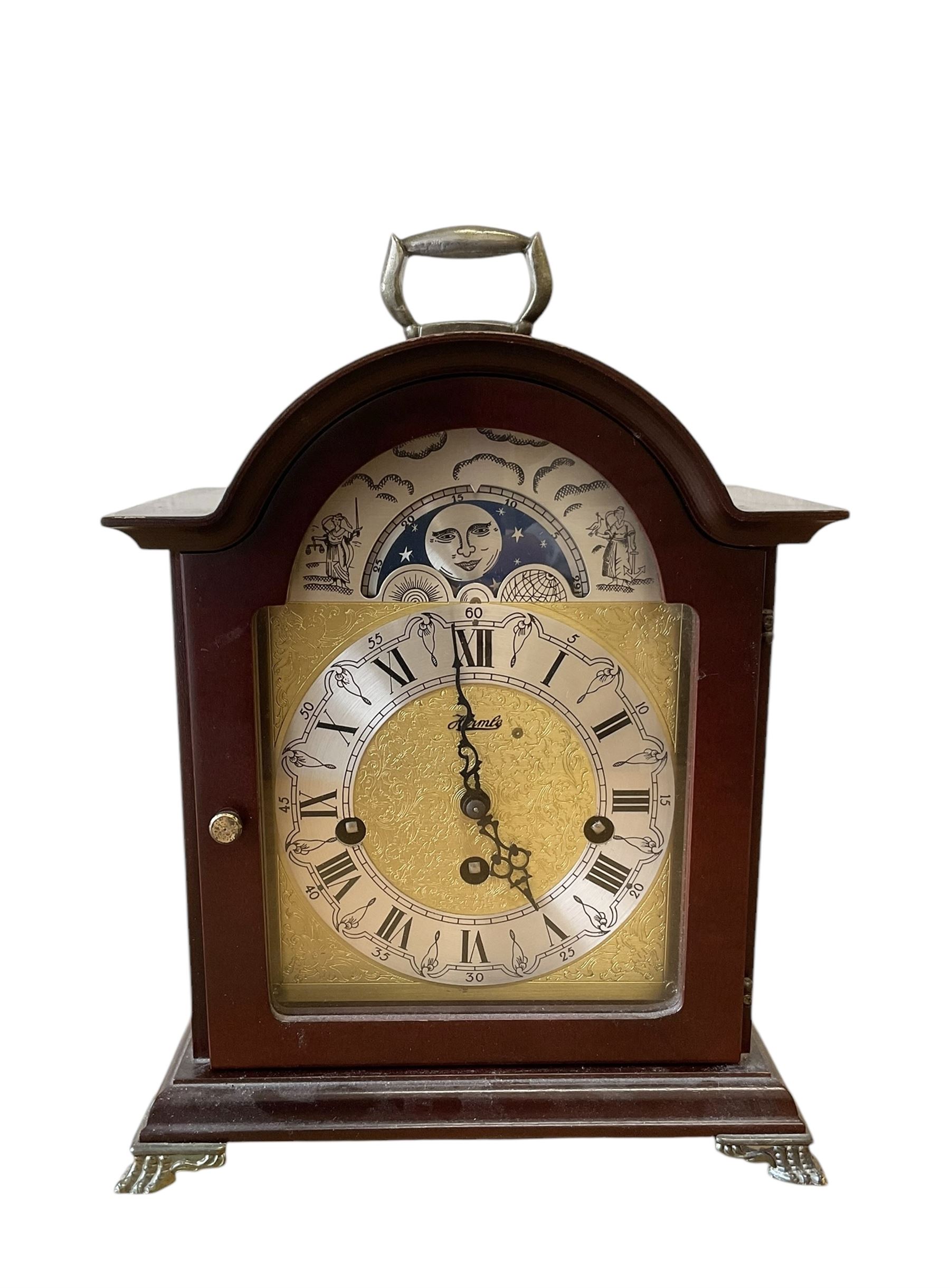 20th century- Hermle 8-day moon phase three train bracket clock, with a brass dial and subsidiary moon dial, floating balance escapement chiming the quarters on 5 gong rods. With an English oak cased Smiths Enfield 8-day striking mantle clock c1950. With pendulum and key.  