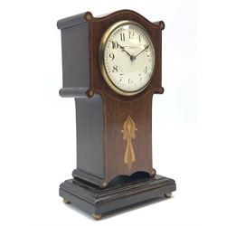  Art Nouveau inlaid mahogany serpentine top mantel timepiece, the  convex white enamel Arabic dial signed Manoah Rhodes & Sons. Ltd. Bradford, with brass bezel and key wind movement, on plinth base with brass ball feet, H26cm  