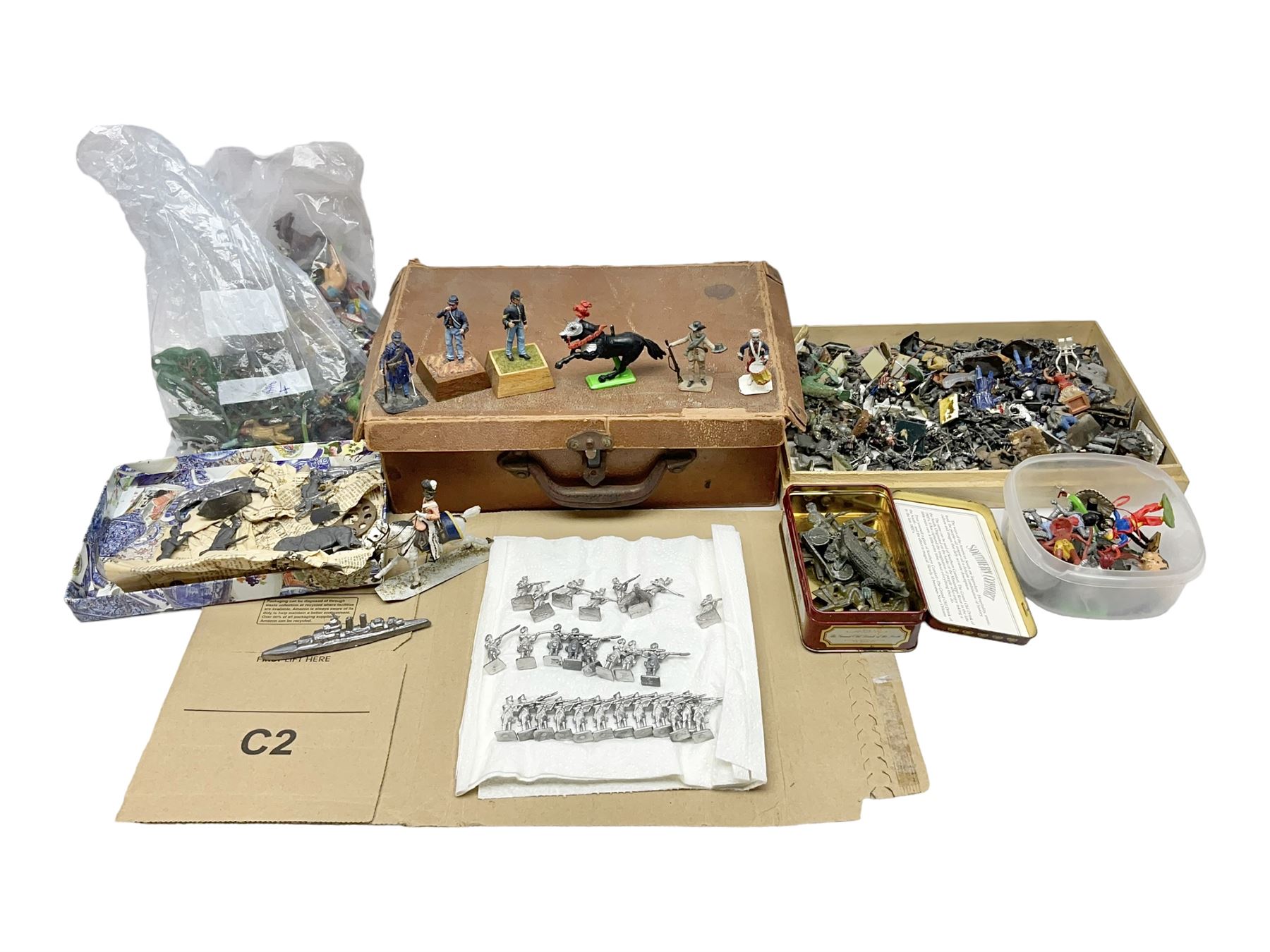 Large variety of predominantly metal miniature soldiers, a mixture of painted and non-painted figures, to include examples of American, British and European soldiers 