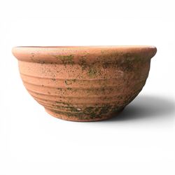 Collection of five terracotta garden planters along with rectangular sandstone trough 