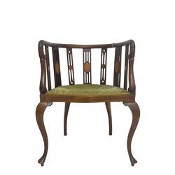 Edwardian inlaid mahogany tub shaped salon chair, the pierced and inlaid splat back over serpentine front, seat upholstered in laurel green velvet, raised on cabriole supports with satinwood stringing
