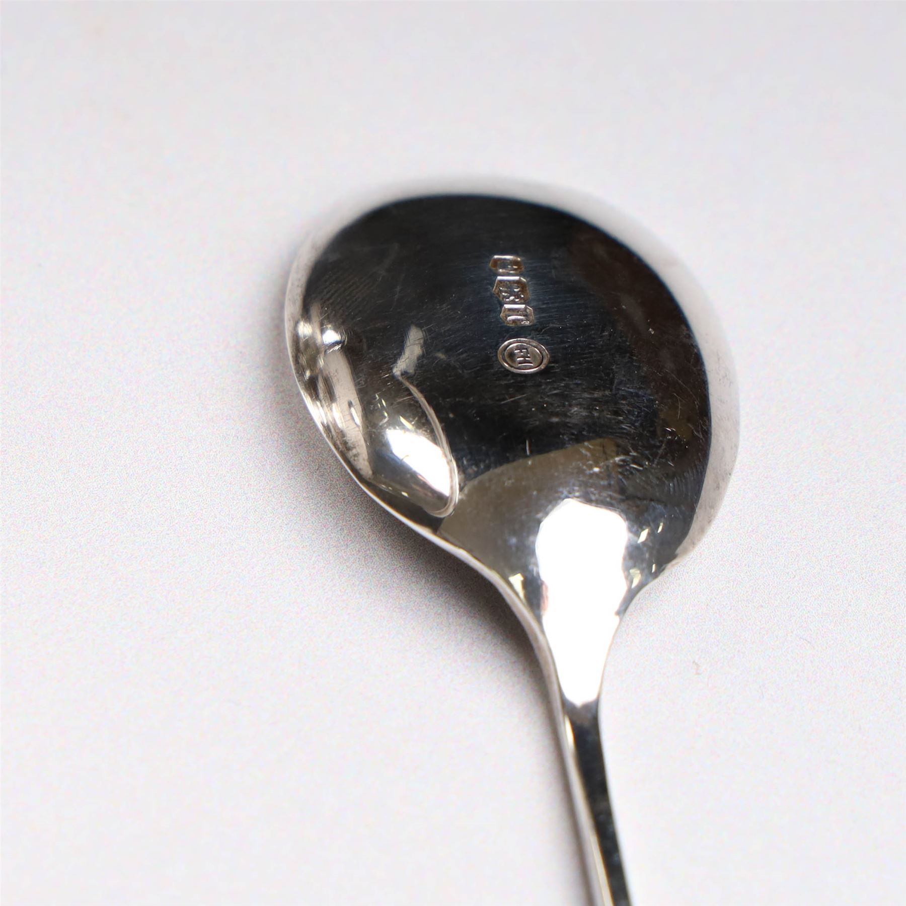Two late 20th century silver christening mugs, each of plain form with no engraving, together with a small seal top spoon, all hallmarked 