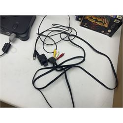 Nintendo 64 console, two controllers, games and accessories. Accessories to include the ‘Tremorpak’ and ‘Spook’ 2 Phono plugs and a S-VHS plug with adapter, both in original boxes. Games to include ‘Golden Eye 007’, ‘Doom 64’, ‘Killer Instinct Gold’, ‘Tetrisphere’, ‘F-1 World Grand Prix’, ‘Pilotwings 64’ and ‘Lylatwars’ with ‘Rumble Pak’, all with original boxes and instruction manuals. ‘Star Wars Episode I Racer’ game cartridge in Shadows of the Empire box. 