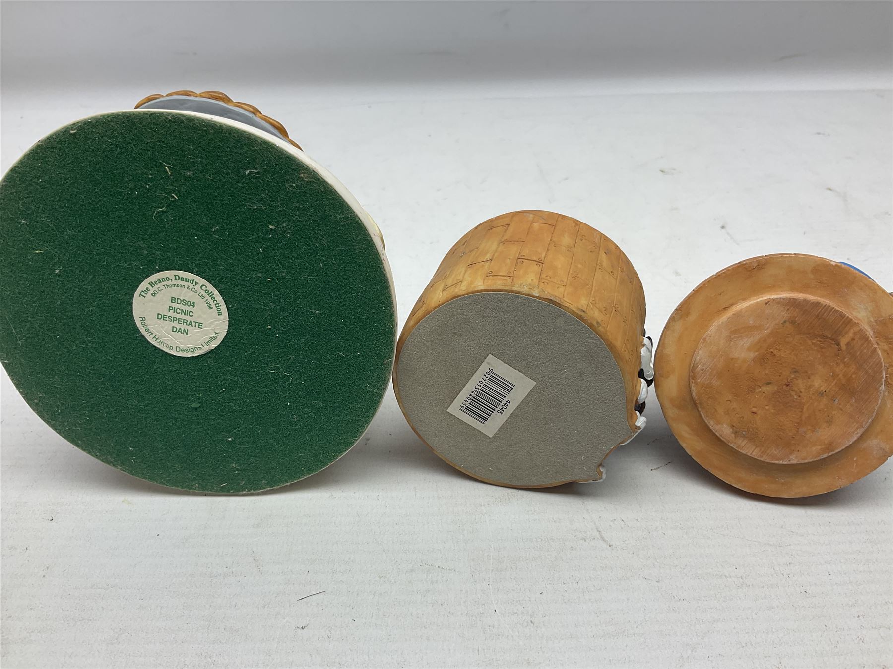 Eleven Robert Harrop figures from the Beano Dandy collection, comprising One Man & His Dawg BDS08, Picnic Desperate Dan BDS04, Fatty BD07, Desperate Dan BD03, Roger the Dodger BD20, Dennis the Menace BD01, Beryl the Peril BD05, Minnie the Minx BD04, Surfing BP03, two Spotty BD16, together with a Genuine Beano Ware lidded box (12)