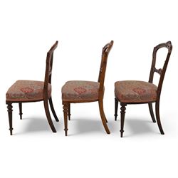 Set of six late Victorian mahogany dining chairs, the shaped top rails carved with anthemion motifs, above pierced splats, floral and geometric fabric seat, on turned and fluted front legs