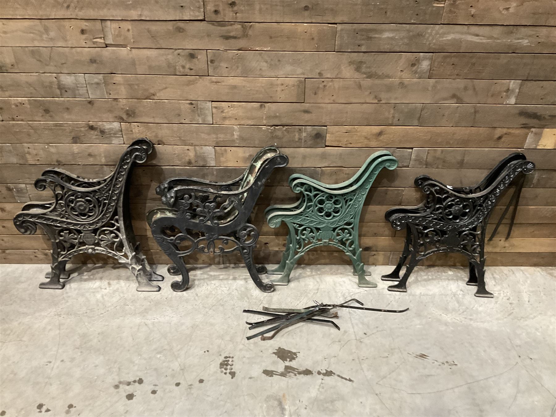 Four pairs of ornate cast iron bench ends (8)