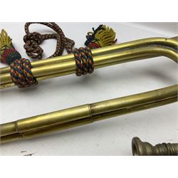 Two military brass bugles by Mayers and Harrison Ltd. Manchester each with crows foot mark and dated 1966; both with multi-coloured cord and tassels, longest 52.5cm (2)