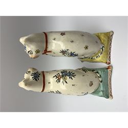 Pair of 19th century Staffordshire cats, modelled seated upon cushions and decorated with polychrome floral sprays, H18.5cm