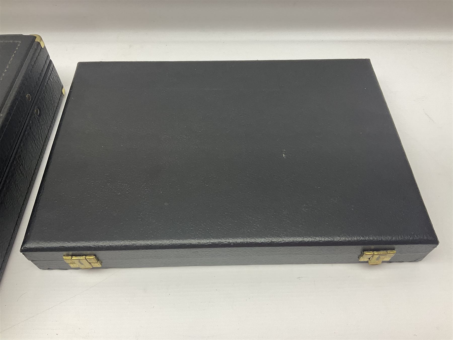 Bestecke Solingen canteen of gold plated cutlery for twelve place settings, including ladle, cake slice and serving spoons, contained within a briefcase, together with a matching set twelve of Bestecke Solingen gold plated fish knives and forks, in fitted case 