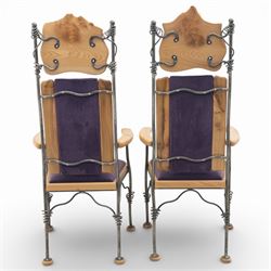 Paul Hodgkiss Designs of Glasgow - contemporary shaped elm dining table with wrought iron base; with set ten (8+2) matching high-back dining chairs, table of organic form above an elaborate wrought iron supports, with central elm stretcher, the chairs with en suite with matching wrought iron work burred elm headrest, purple velour upholstery with drop in seat     

Table: W 102cm, L 243cm, H 74cm
Chairs: W 56cm, D 52cm, H 130cm