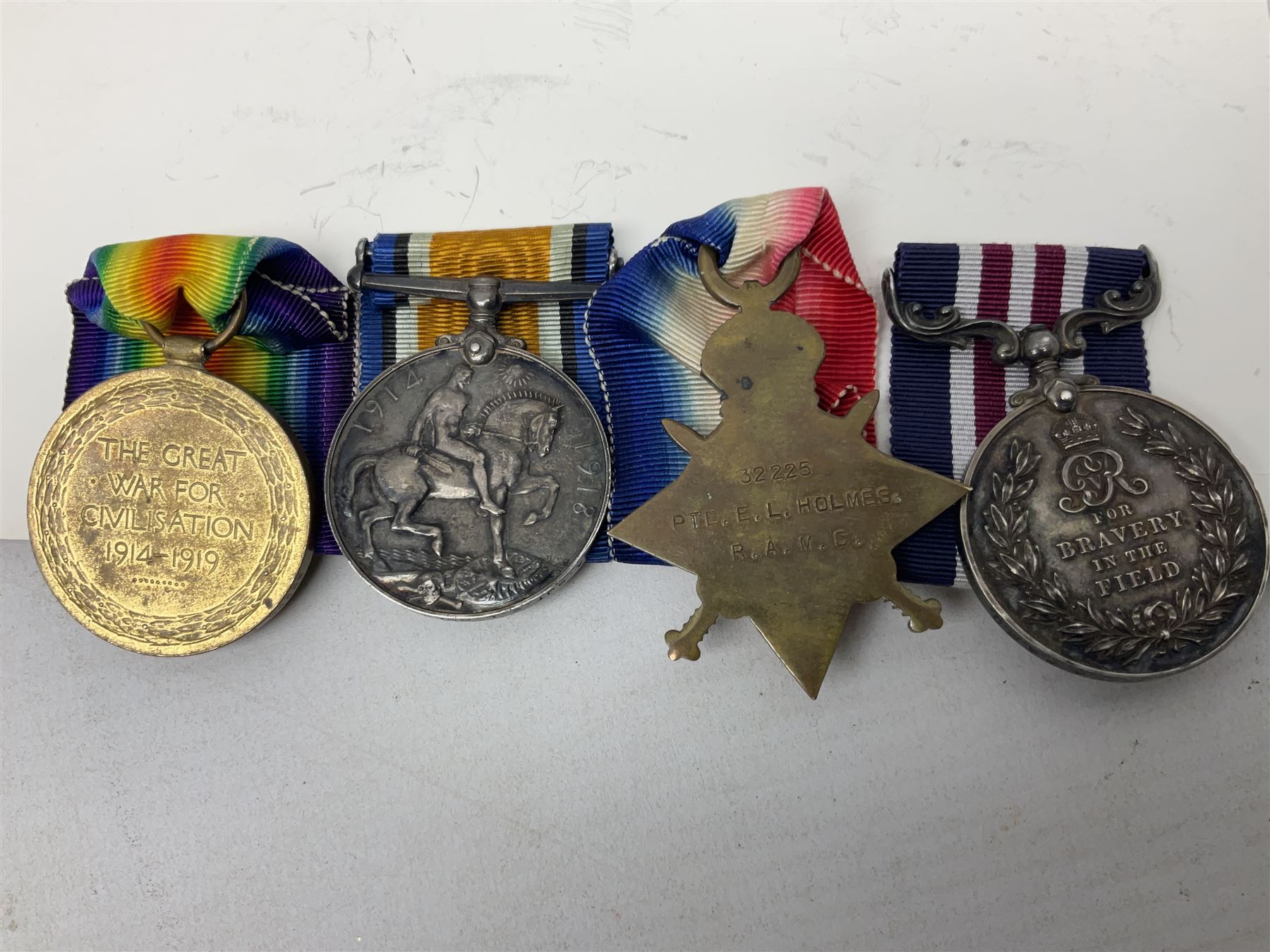 WW1 Military Medal KIA group of four comprising MM, British War Medal, 1914-15 Star and Victory Medal awarded to 32225 Pte. (later A.Sjt.) E.L. Holmes R.A.M.C., the MM inscribed 28F/A R.A.M.C.; all with ribbons; together with photocopied research material including newspaper article with presentation photograph, CWGC certificate,  London Gazette entry etc