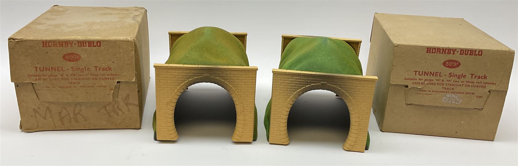 Hornby Dublo - two 5091 Single Track tunnels, both boxed; matching large Double Track tunnel; and pre-war wood and card long tunnel, both unboxed (4)