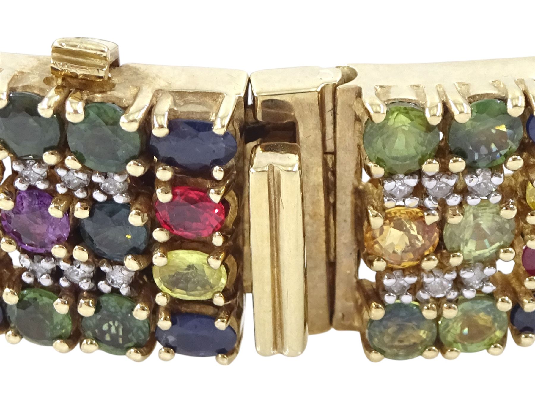 9ct gold sapphire, ruby and diamond bracelet, vari-cut blue fancy coloured sapphires, oval cut rubies and round brilliant cut diamonds, Birmingham 2006