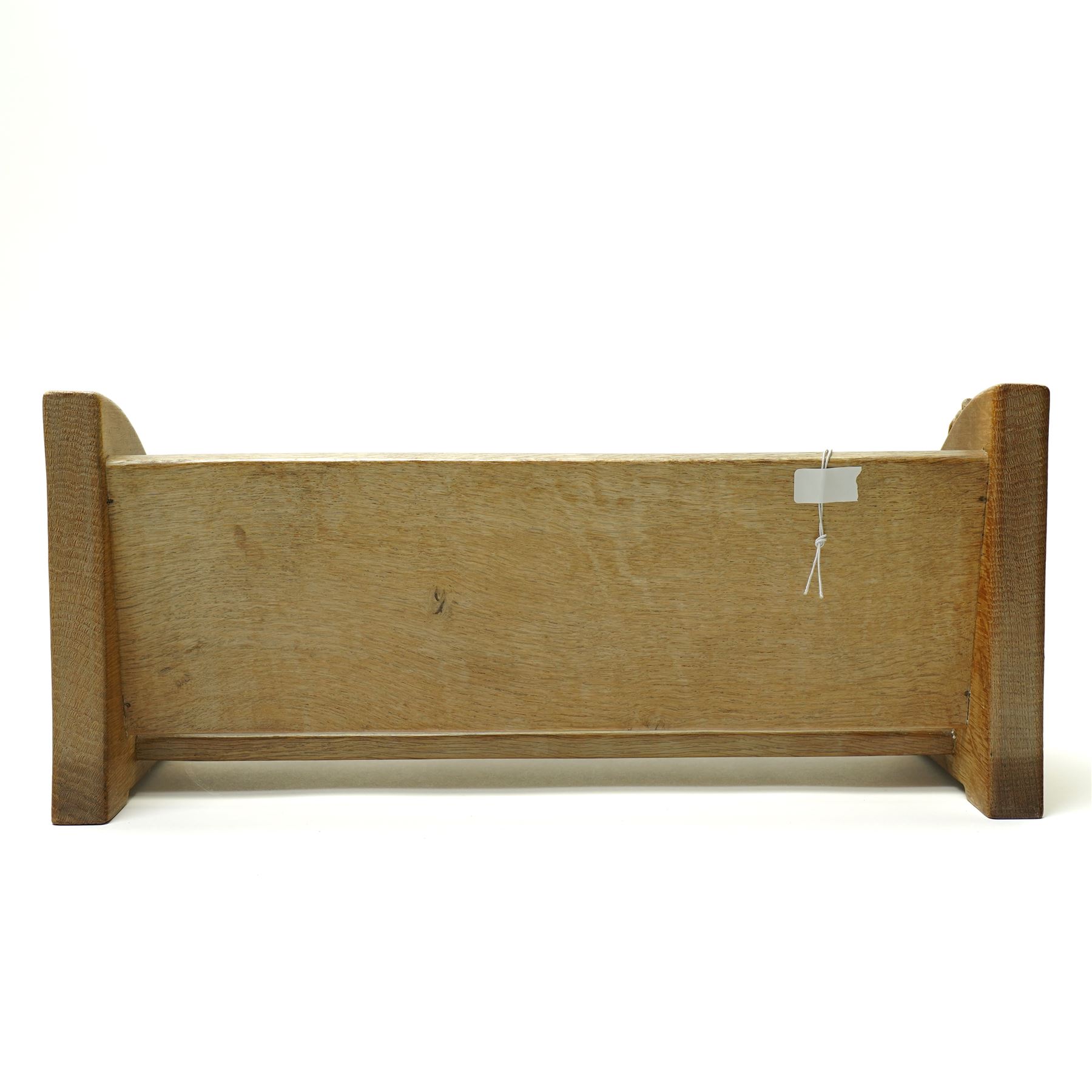 Mouseman - oak book trough, curved end supports, with carved mouse signature, by the workshop of Robert Thompson, Kilburn W46cm