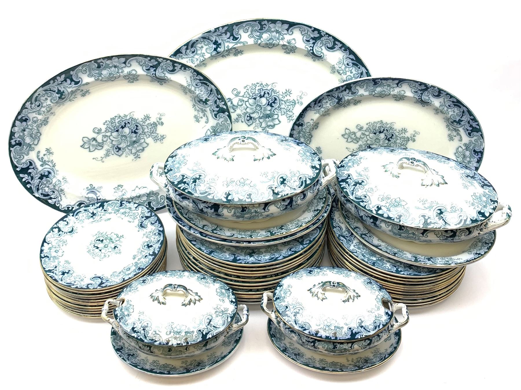 Alfred Meakin Ormonde patter dinner wares, comprising twelve dinner plates, twelve salad plates, twleve side plates, two large tureen and covers, and stands, two smaller tureen and covers and stands, and four graduated oval serving platters.  