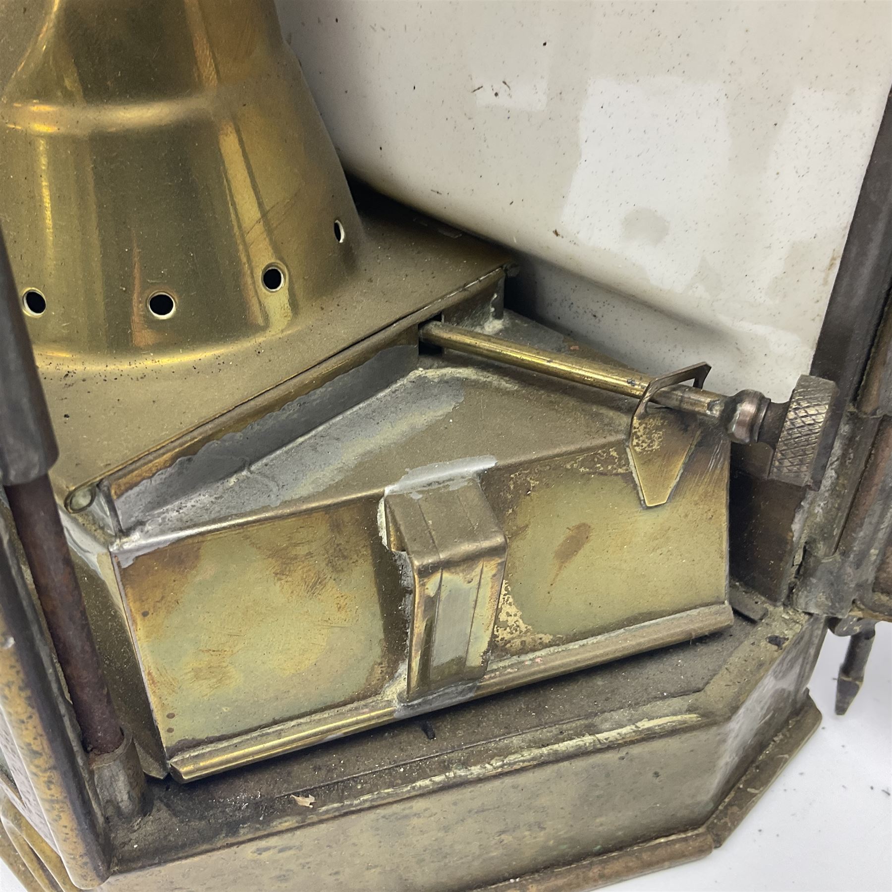 Large brass maritime lamp by Griffiths & Sons Birmingham with swing handle, threaded mounting bracket and associated oil burner, H41cm excluding handle